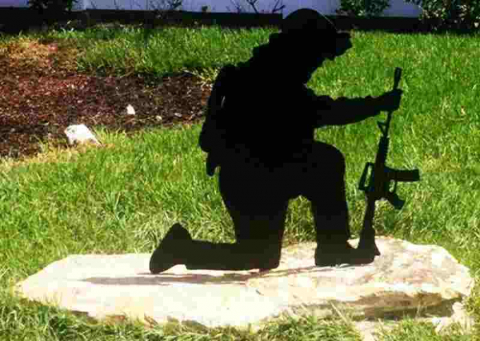 lifesize silhouette praying soldier gun rifle